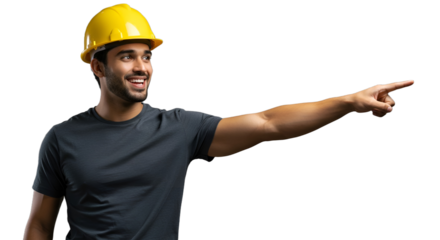 Cheerful construction worker in a yellow hard hat smiling and pointing to the side. Confident engineer indicating a direction.