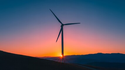 Obraz premium Vast green energy farm with colossal turbines on a hilltop capturing the suns last rays during a breathtaking sunset creating a silhouette against the vibrant sky