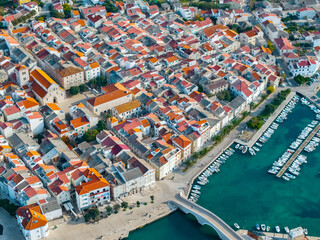 Detailed aerial photo of the historic town center of Pag, Croatia, with its terracotta rooftops and medieval architecture
