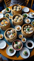 A vibrant overhead shot of a dim sum feast on a round table with multiple bamboo steamers filled with dumplings, buns, and rice rolls,