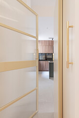 Modern culinary ambiance: gray cabinetry, marble countertops, and stainless steel accents for a sleek look