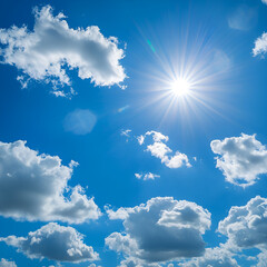 Bright sun shining through fluffy white clouds on a vibrant blue sky, sunny weather background, white fluffy clouds in the blue sky
