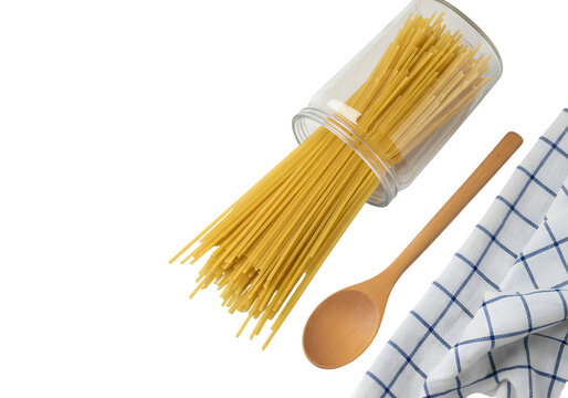 Raw Spaghetti in Clear Glass Jar with Wooden Spoon and Kitchen Towel Isolated on PNG Background. - Powered by Adobe