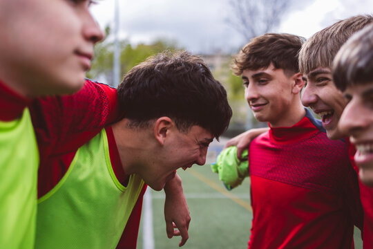 Happy soccer team preparing for match