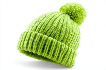 Cozy knitted lime green beanie hat with a pom pom isolated on white background