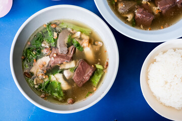 Pork entrails and blood jelly soup bowl with rice. Asian food style