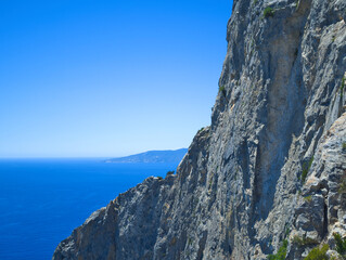 Argentario, Italy. Cliff with Giglio Island in the background