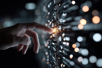 A hand interacts with a digital data wall