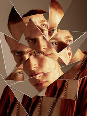 Bold artwork of young man face reflected in shattered mirror pieces with intense expression....