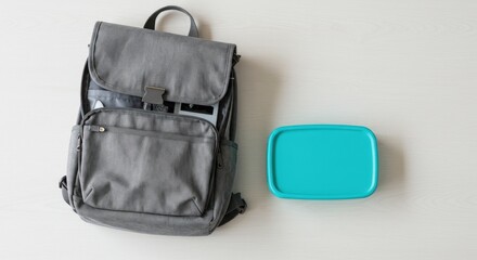 Gray backpack and teal lunchbox