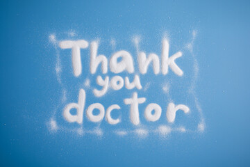 Thank you doctor written in white on blue background  