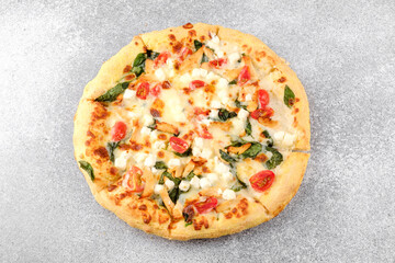 Whole pizza on gray background for pizzeria menu or food delivery concept