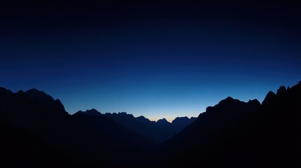 Fototapeta premium A majestic mountain silhouette against a twilight sky, radiating calm and natural beauty.