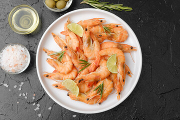 Shrimp dish with salt, olives and oil on slate background for tapas or Mediterranean appetizer concept