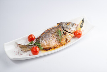 Baked sea bream fish with vegetables