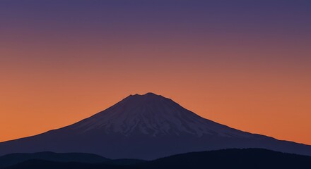 A majestic mountain peak silhouetted against a vibrant gradient sky of orange and purple during the tranquil hours of either sunrise or sunset.