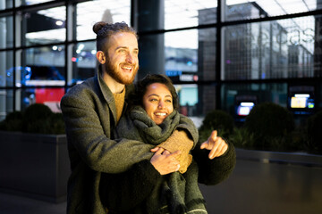 Happy young couple embracing in the city, London, UK