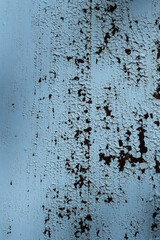 Aged colorful wall with flaking paint and plaster - Rustic wall with chipped paint and plaster peeling - Cracked plaster painted colorful wall