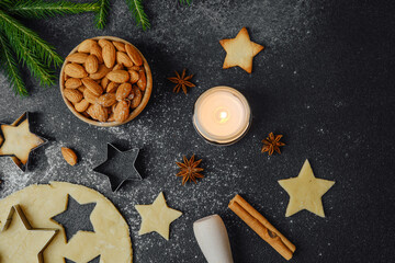 Holiday cookie making with almonds and candlelight for cozy christmas flatlay and food photography concept