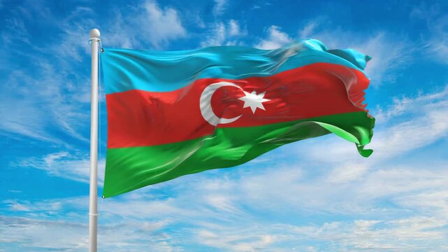 Azerbaijan flag waving proudly in the wind against a bright blue sky, celebrating national pride and independence day dynamically.