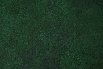 Dark green textured wall with aged rough plaster and grunge pattern