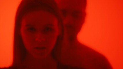 Abstract Art with Two Blurred People in Red Light