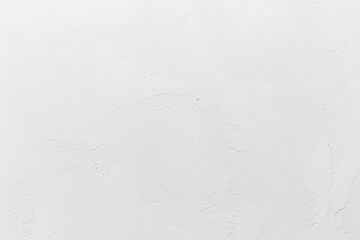 Textured white wall with subtle patterns and smooth finish indoors
