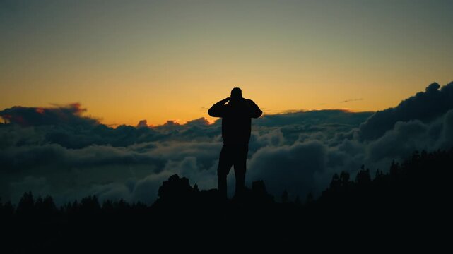 Silhouette of a Man Above the Clouds at Sunset &ndash; Volcanic Landscape in Tenerife