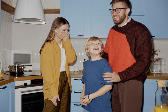 Happy family in the kitchen enjoying time together