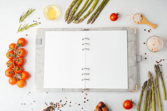 Blank recipe book with cooking ingredients on white background - Powered by Adobe