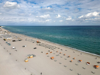 Beach vacation at sea in summer. Sea relax under beach umbrella. Travel sea. Aerial top view of sand beach with turquoise water. Luxury resort. Paradise beach. Summer vacation. Coastal morning walk