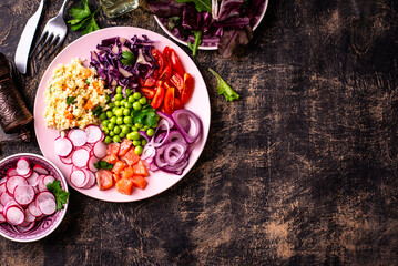 Balanced healthy bowl with vegetables and salmon