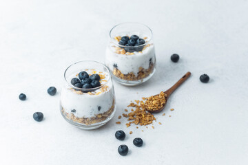 Yogurt granola parfaits topped with fresh blueberries
