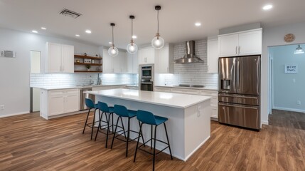 Modern white kitchen with sleek cabinetry, undercabinet led lighting, glossy surfaces, and a spacious island with blue bar stools, capturing a contemporary and inviting culinary space