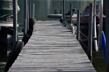 old wooden boat dock gangway on lake