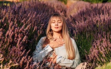 Woman Practicing Meditation and Breathing Exercises in Lavender