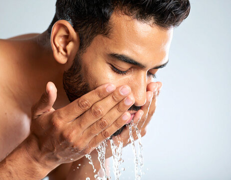 A man washes his face - Powered by Adobe