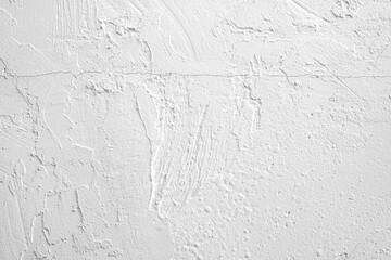Textured white wall with subtle patterns and imperfections in a bright setting