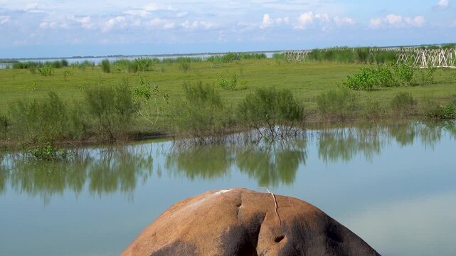View of River Brahmaputra with clouds in the sky and porcupines for flood control 1