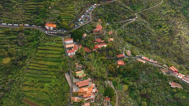 Aerial view of Masca village surrounded by dramatic cliffs and green terraces, Tenerife, Canary Islands