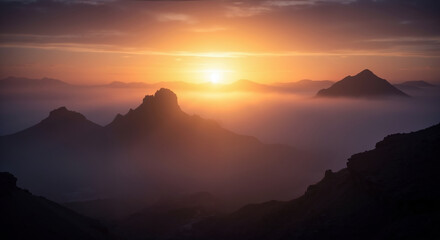 Mountain silhouettes layered against orange sunset sky with atmospheric haze. Rocky peaks in natural landscape for environmental awareness and nature conservation campaigns