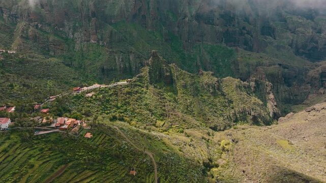 Scenic aerial view of Masca village under clouds with sun rays breaking through, Tenerife, Canary Islands