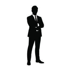 Silhouette of a businessman standing with arms crossed