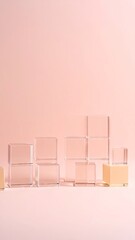 Transparent Glass Blocks Arranged Against A Soft Pink Background In A Minimalist Geometric Composition