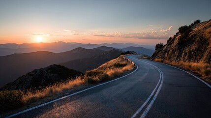 Fototapeta premium Winding road at sunset, mountain vista