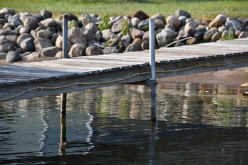 cottage boat dock empty shoreline rocks