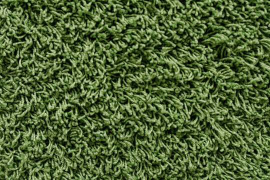 High-resolution image of a soft, green shag carpet texture. Perfect for backgrounds and design projects.