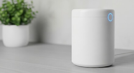 Modern white cylindrical smart home device with blue logo on a desk