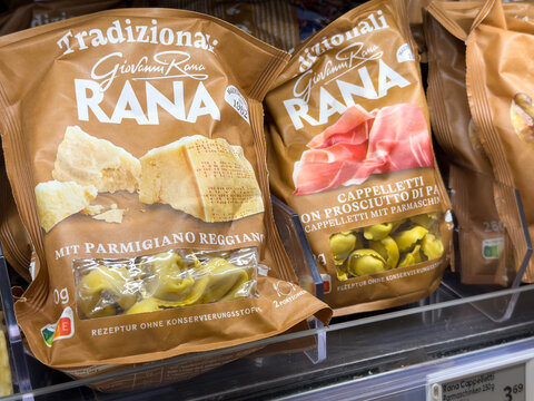 Villach, Austria - July 28, 2025: Gnocchi and cappelletti pasta packages from Giovanni Rana displayed on supermarket shelf, showcasing traditional Italian cuisine and vibrant packaging design