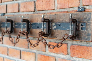 Industrial Wall with Chains and Clamps